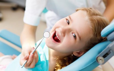 At what age should children first visit a dentist, and what treatments are safe for them?